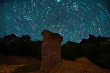 Vortex Night Exposure Star Trails of the Sky in Phae Mueang Phi Forest Park.