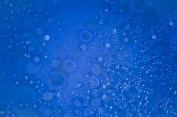 Abstract bubbles blue bokeh background