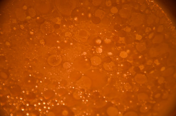 Abstract bubbles orange bokeh background