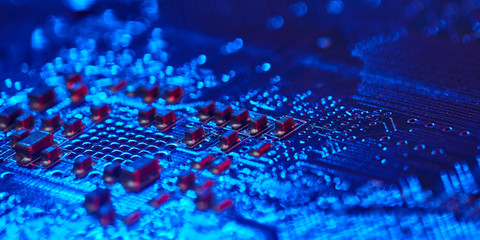 chip is highlighted with blue light. Technology background