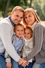 Happy family having fun together in the park outdoor