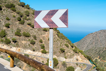Road sign on the highway in the north of the island of La Gomera between the small towns Vallehermoso and Agulo