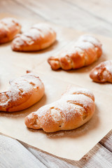 Homemade sweet rolled bun with custard filling and sugar powder
