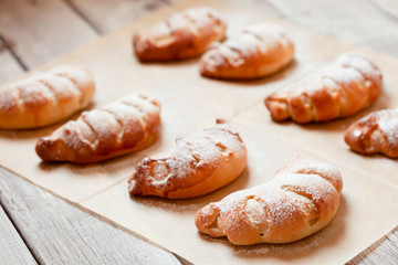 Homemade sweet rolled bun with custard filling and sugar powder