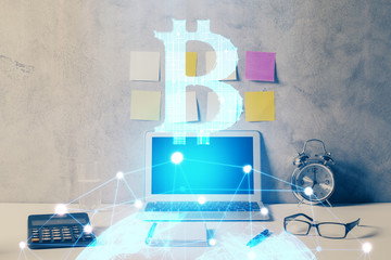 Double exposure of blockchain and crypto economy theme hologram and table with computer background....