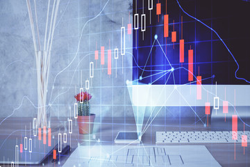 Stock market graph and table with computer background. Double exposure. Concept of financial analysis.