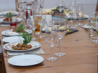 Beautifully served table with drinks, snacks and caprese salad
