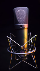 studio condenser microphone, isolated on black. with Amber Light