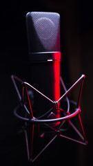 studio condenser microphone, isolated on black.