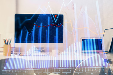 Financial chart drawing and table with computer on background. Double exposure. Concept of international markets.