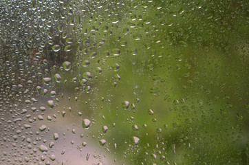 Rain drops on window glass.