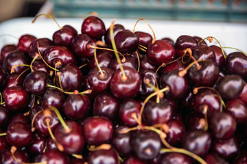Pile of fresh organic cherries for sale at local market