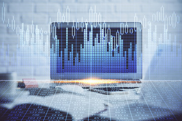 Financial graph colorful drawing and table with computer on background. Multi exposure. Concept of international markets.