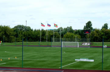 soccer field with the flags of Russia and Tatarstan
