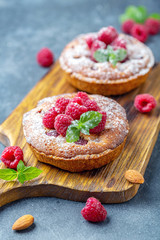 Delicious mini-tarts (tartlets) with raspberries.