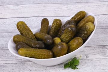 Pickled cucumbers heap in the bowl