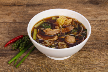 Thai style soup with meat and mushrooms