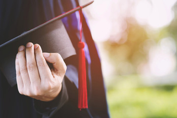 Graduates of the University,of graduate holding hats along with success, Education congratulation concept.