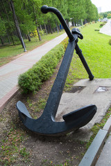 Anchor ocean ship in the Park on a background of green trees. The ships of the sea.