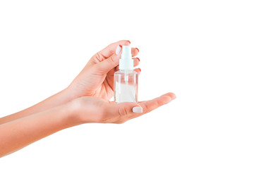 Female hand holding cream bottle of lotion isolated. Girl give tube cosmetic products on white background