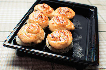 Delicious set of rolls of rice and fish.