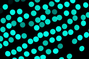 Unfocused abstract colourful bokeh black background. defocused and blurred many round blue light