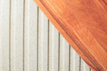 Wooden board for butchering meat lies on kitchen sink.