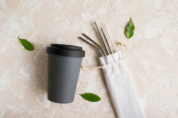 Reusable eco friendly sustainable handy bamboo cup and stainless steel metallic straws. Zero waste