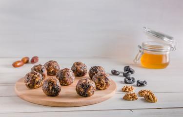 vegetarian food, energy balls of walnuts, dates, prunes, cranberries and honey