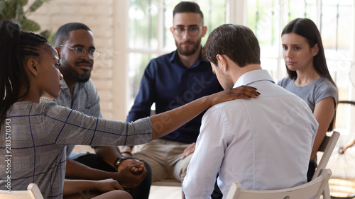 Rear view at upset man feel depression get psychological support