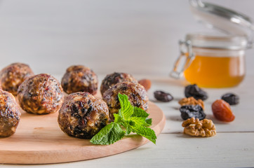 vegetarian food, energy balls of walnuts, dates, prunes, cranberries and honey