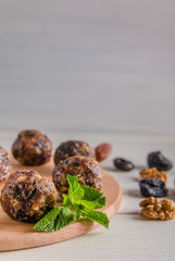 vegetarian food, energy balls of walnuts, dates, prunes, cranberries and honey