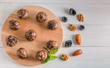 vegetarian food, energy balls of walnuts, dates, prunes, cranberries and honey