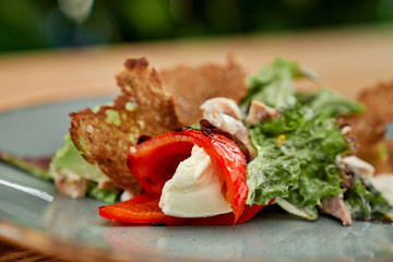 Closeup of pepper with cheese, crunches and fresh green