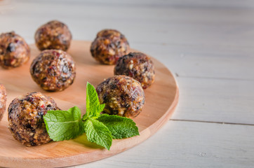 vegetarian food, energy balls of walnuts, dates, prunes, cranberries and honey