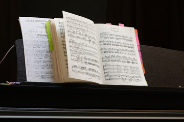 music sheets on a music stand on a piano of the Operette Fledermaus from Johann  Strauss