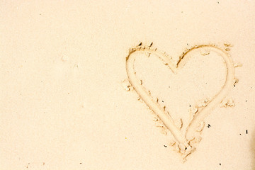 Panoramic views of the sandy beach, the mountains and footprints in the sand at low