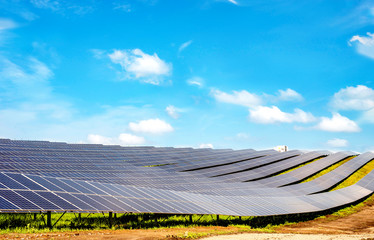 Rows of solar panels on the steep hills of the field