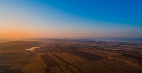 Fototapeta premium A field and a clear sky, aerial view.