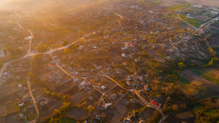 A beautiful village at sunrise, shot from above.