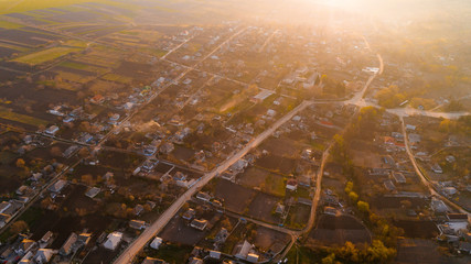 A picturesque shot of a village at sunrise, aerial view.