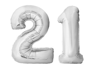 Number 21 twenty one made of silver inflatable balloons isolated on white background. Silver chrome...