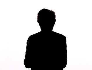 black silhouette of an unknown person isolated on white background