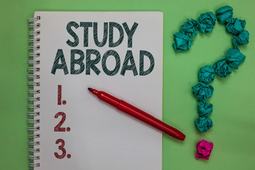 Handwriting text Study Abroad. Concept meaning Pursuing educational opportunities in a foreign...