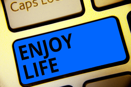 Writing note showing Enjoy Life. Business photo showcasing Any thing, place,food or person, that makes you relax and happy Keyboard blue key Intention computer computing reflection document