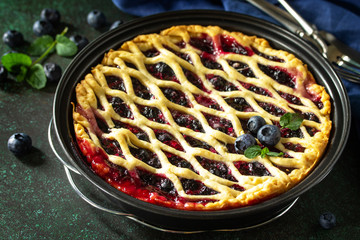 Homemade Berry pie. Sweet pie, tart with fresh blueberry. Delicious cake with blueberry.