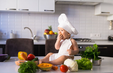  little boy, white chef hat, vegetables