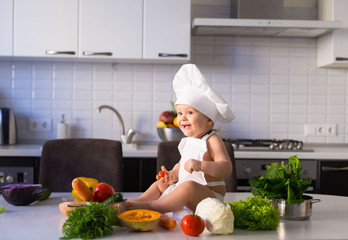  little boy, white chef hat, vegetables