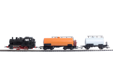 Model of a steam locomotive and passenger cars on rails on a white background