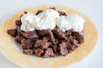 Perspective shoot of home cook fresh meat with yogurt on plate with white background